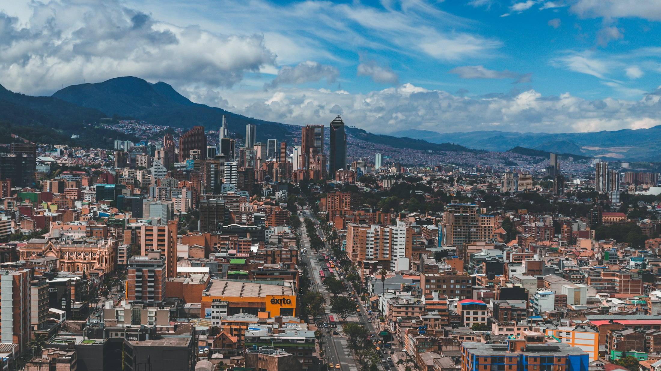 The Bogotá skyline with the eastern hills under a blue sky